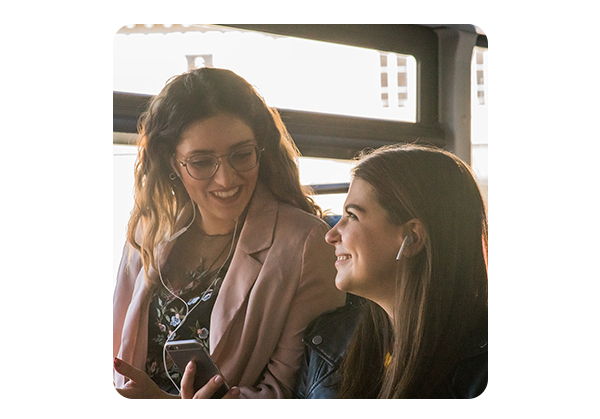 Refreshing Happy friends laughing at their smartphone